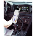 woman driving car, summer outside city, increases volume on radio, touch screen, automatic transmission, radio station selection, mechanical adjustment of air conditioner level.